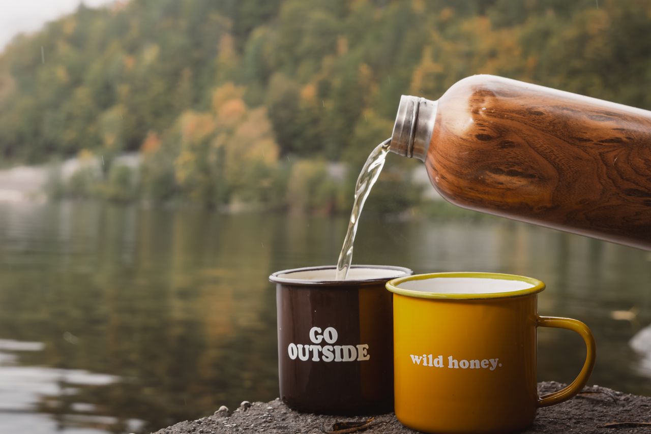 services-01 Enjoying a warm coffee moment by the lake with autumn foliage reflections in Bad Aussee, Austria.