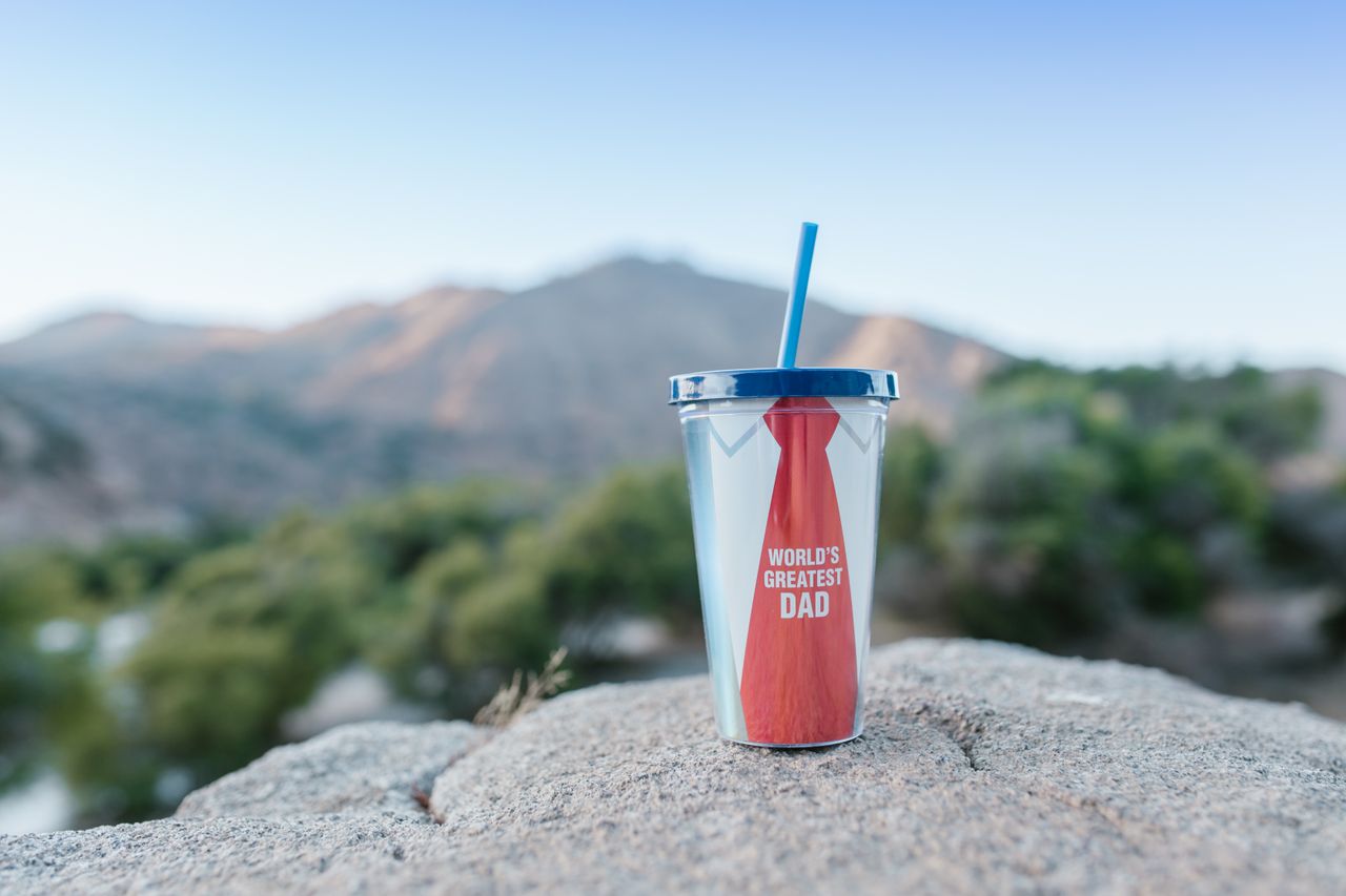 why-choose-us Focus on a personalized tumbler with a mountain backdrob, ideal for Father's Day.